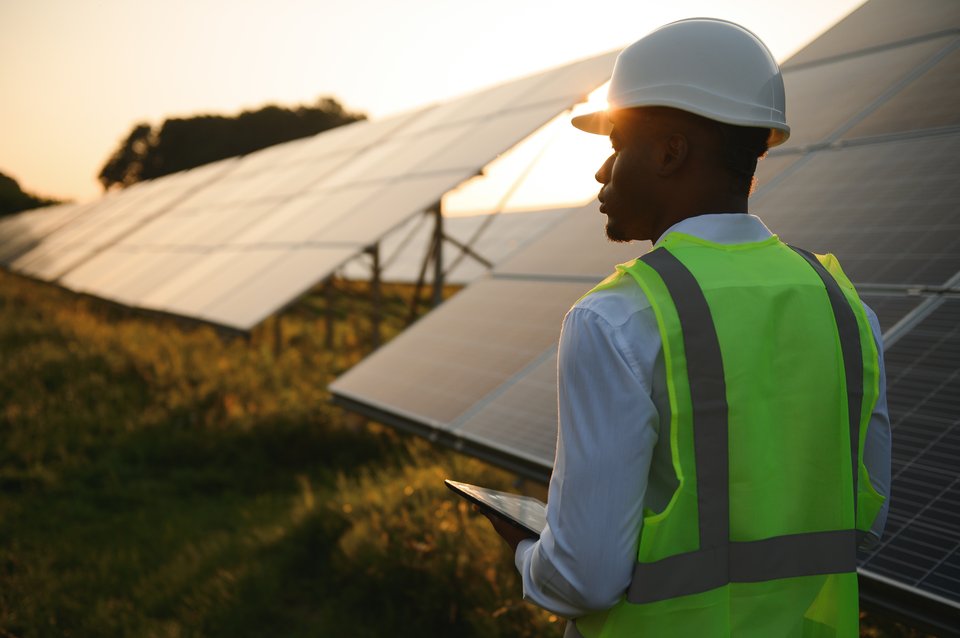 African man working at solar farm