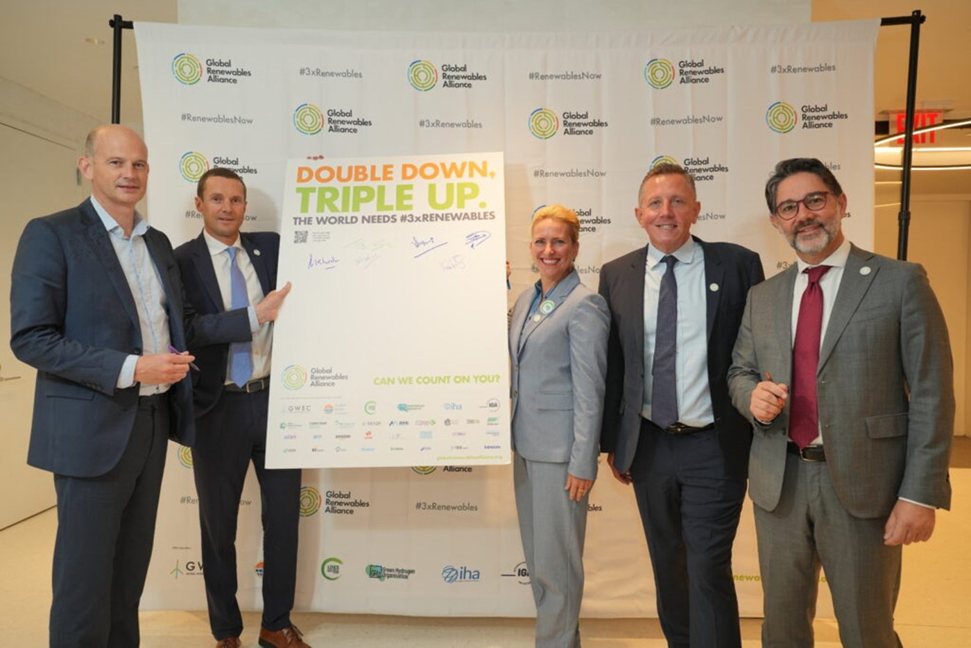 Bruce Douglas, Gianni holding Double down triple up sign