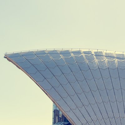 Curved, cantilevered roof with panels