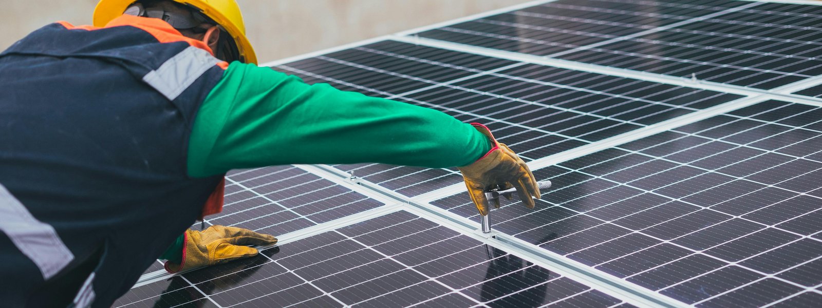 Workers installing solar panels