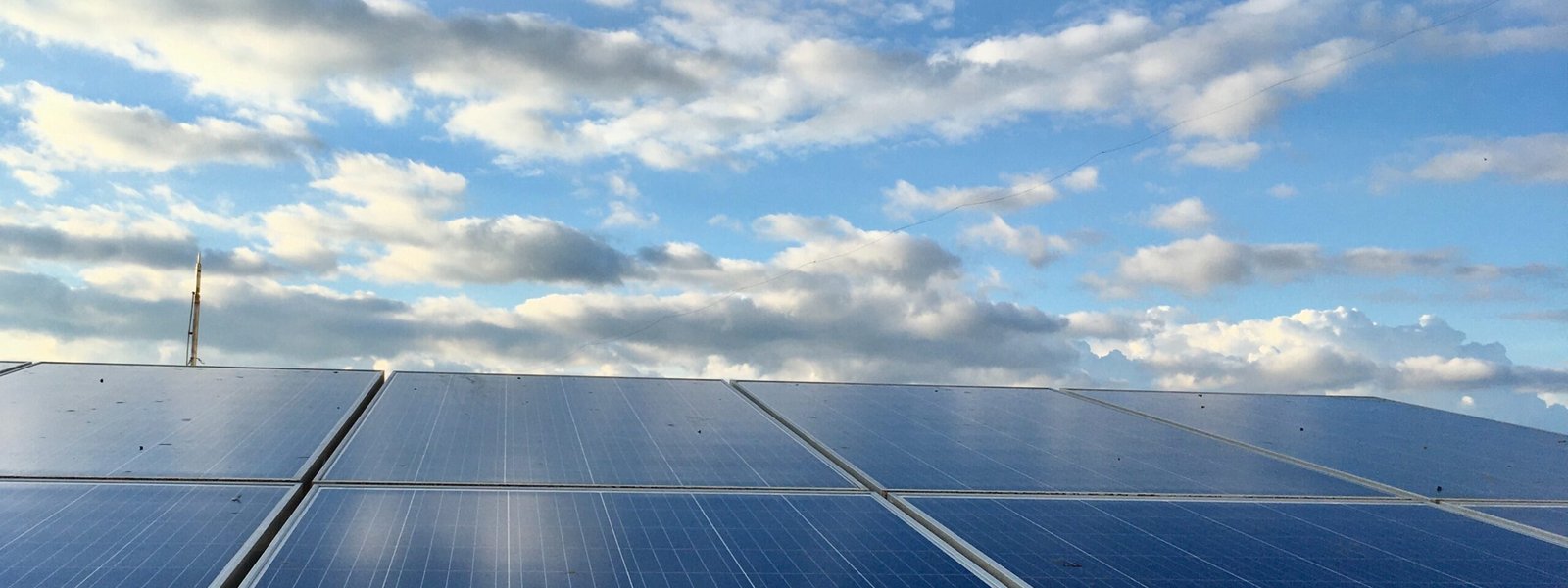 Long view up panels toward a sky with low light