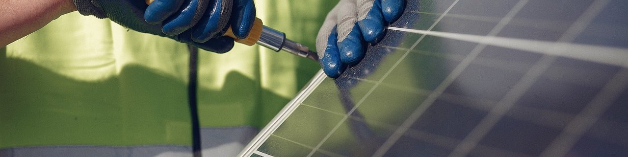 Closeup of worker, hands, working on panel